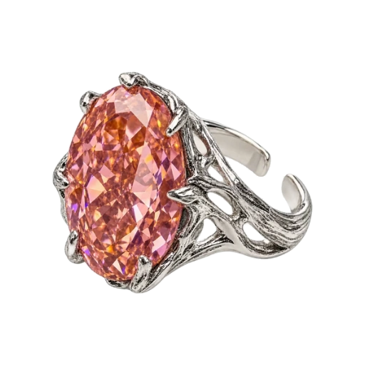 Angled studio view of The Blush Ring showing its pink oval stone and open sculptural silver-tone band